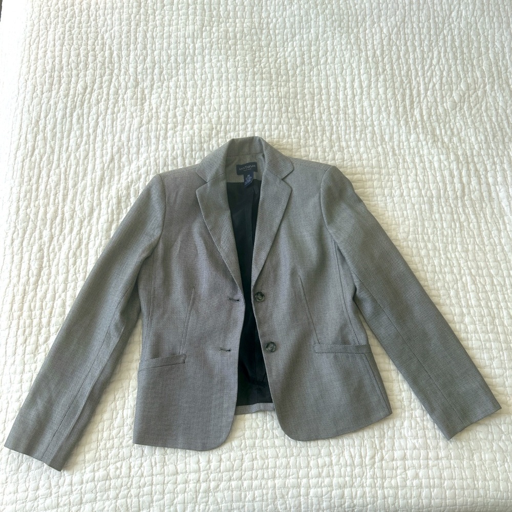 Made of 55% Wool, 39% Raylon, 6% Silk.